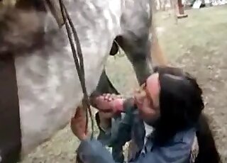 Black-haired chick affectionately sucks it